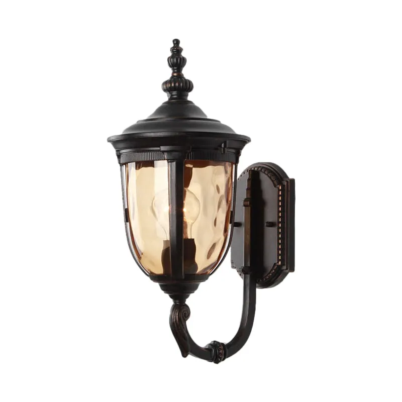 Traditional Wall Sconce: 1-Light Black Lamp with Amber Water Glass Urn Shade